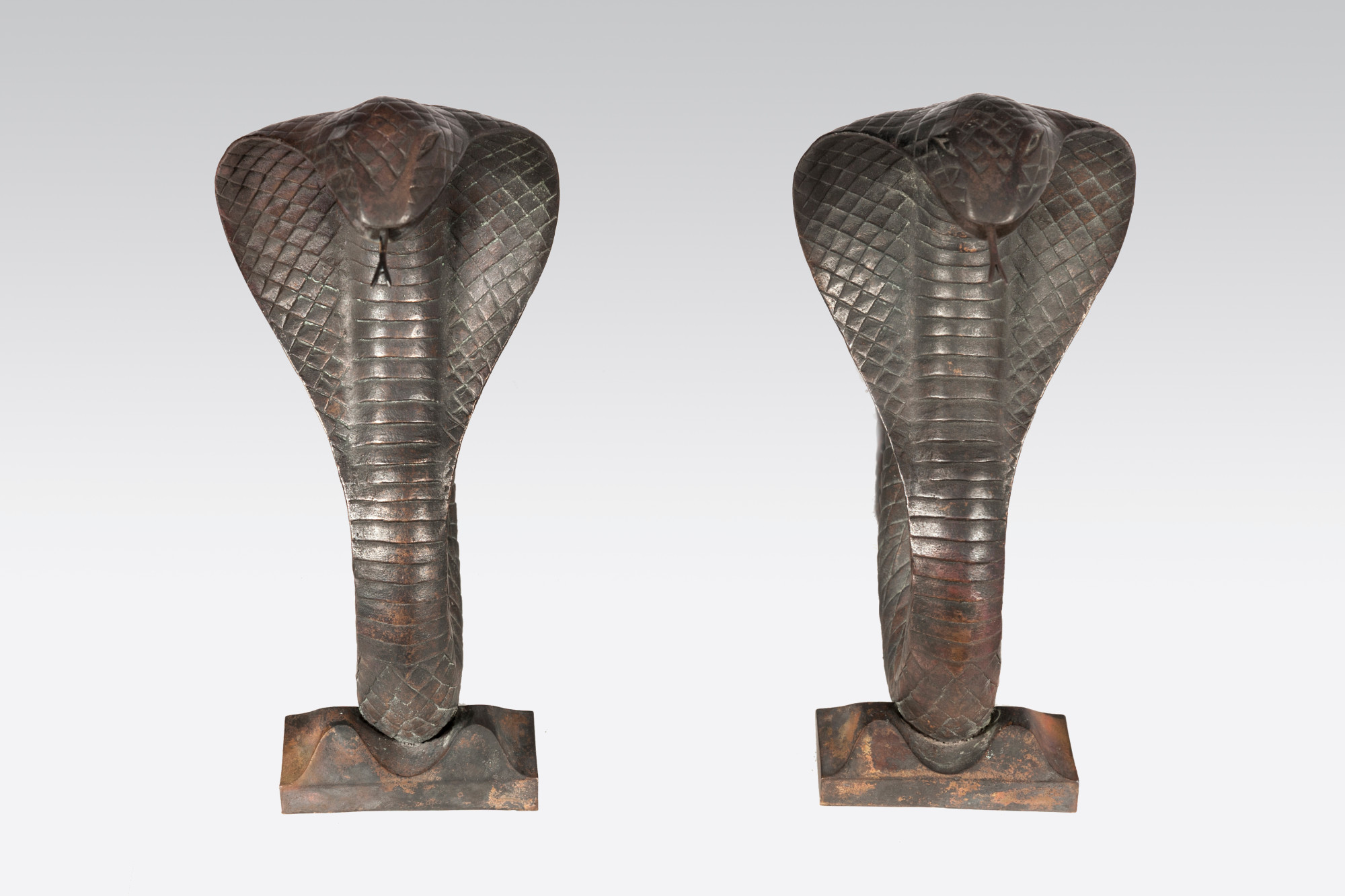 Pair of cobra andirons by Edgar Brandt
